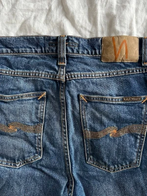 Lean dean nudie jeans - Säljer ett par riktigt snygga nudie jeans i strl 29/32 som jag använt väldigt få gånger då de blev för små för mig. || Fråga på om det är något!