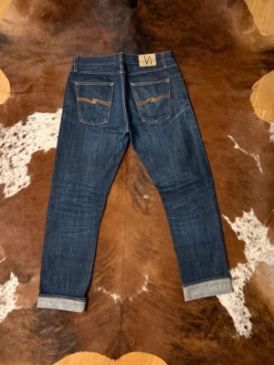 Selvage Nudie SharpBengt - Tjena! Säljer dessa riktigt feta Nudie jeans, modellen är SharpBengt DryOrangeSelvage och tillverkas inte längre, W34/L36, hör av dig vid funderingar!🙌