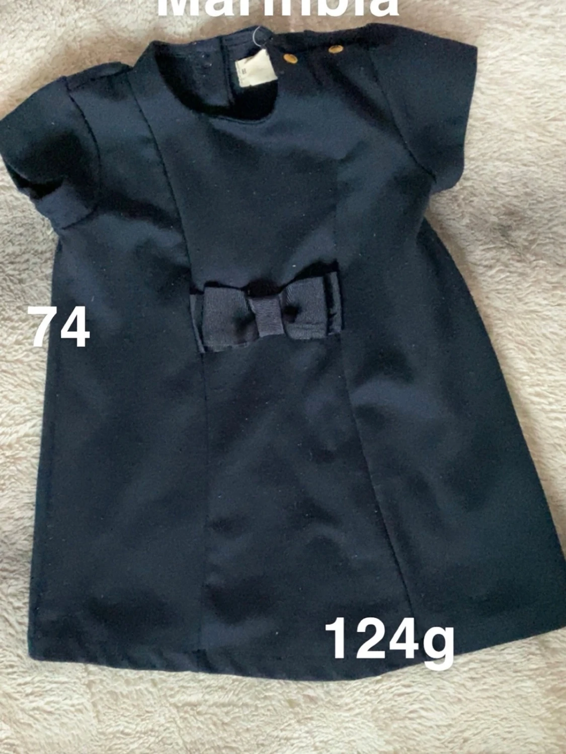 Mörkblå klänning med rosett