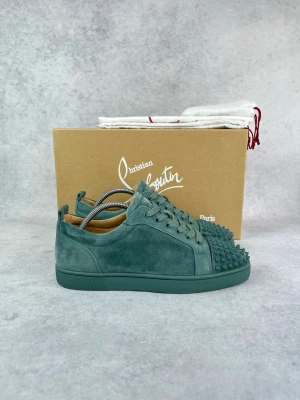 Christian Louboutin junior spike sneaker - – Condition: 9/10 - flawless  – Color: Green  - What is included: Box, Dustbag & extra laces  – Retail price: 9000 + SEK