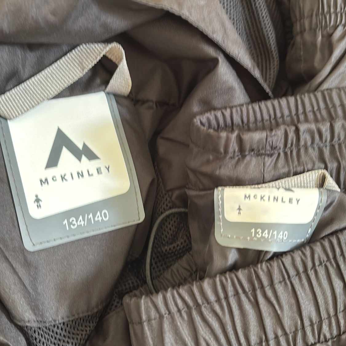 Blå och svart vindjacka och överdrag McKinley 134/140 - 2