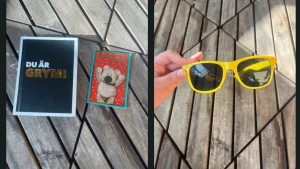 Gula solglasögon med bok och vykort  - Snygga solglasögon med klargul båge och en bok med ett vykort  