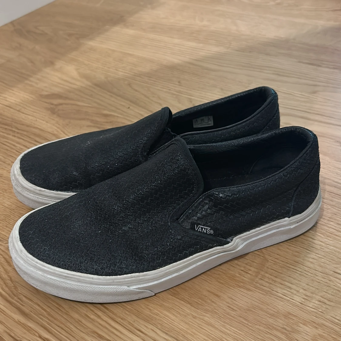 Svarta Vans slip-on sneakers