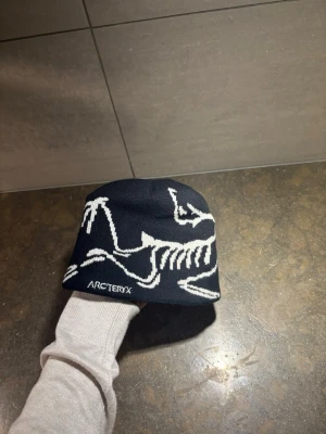 Arc’teryx mössa - Arc’teryx mössa                                                           Har ingen stl, aldrig använd