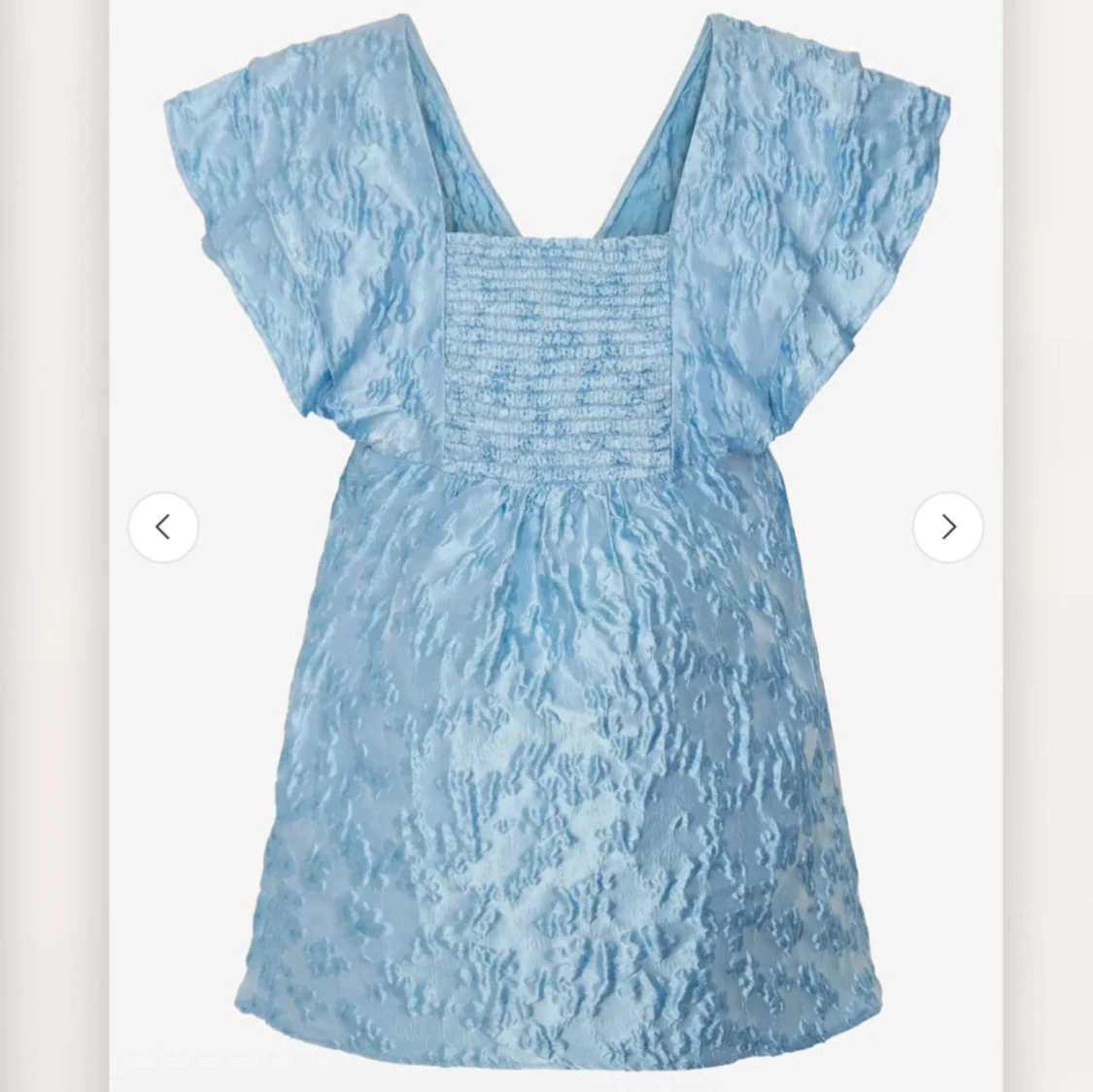 Ljusblå miniklänning med volang - 1