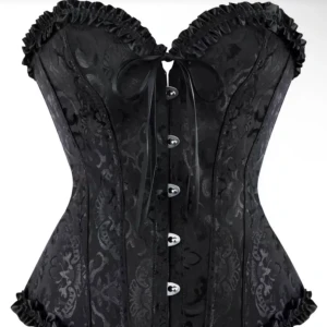 slutsåld Svart korsett med snörning och volang - Snygg svart korsett med satinsnörning fram och bak, dekorerad med volangkant upptill och nedtill. Mönstrad yta i blankt tyg ger en lyxig känsla. Stängs med metallknappar framtill och har en rosett vid bysten. Perfekt för dig som vill sticka ut.