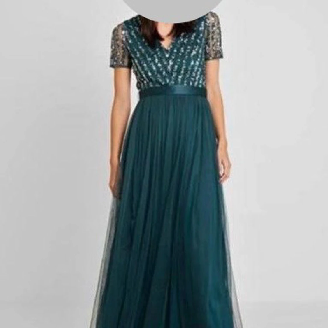 Mörkgrön långklänning med paljetter