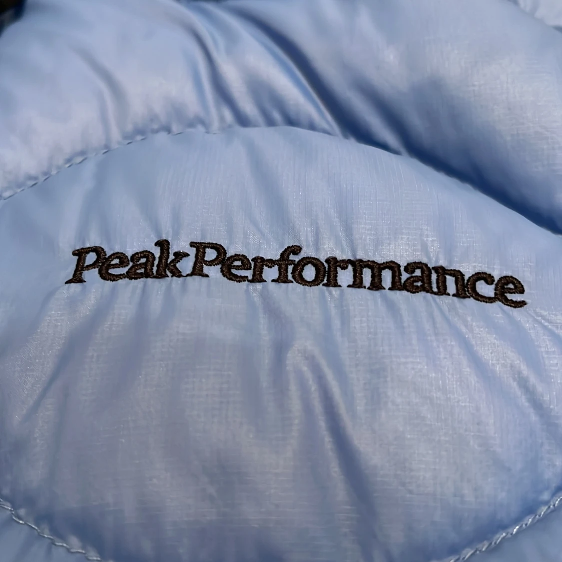 Blå dunjacka från Peak Performance - 93