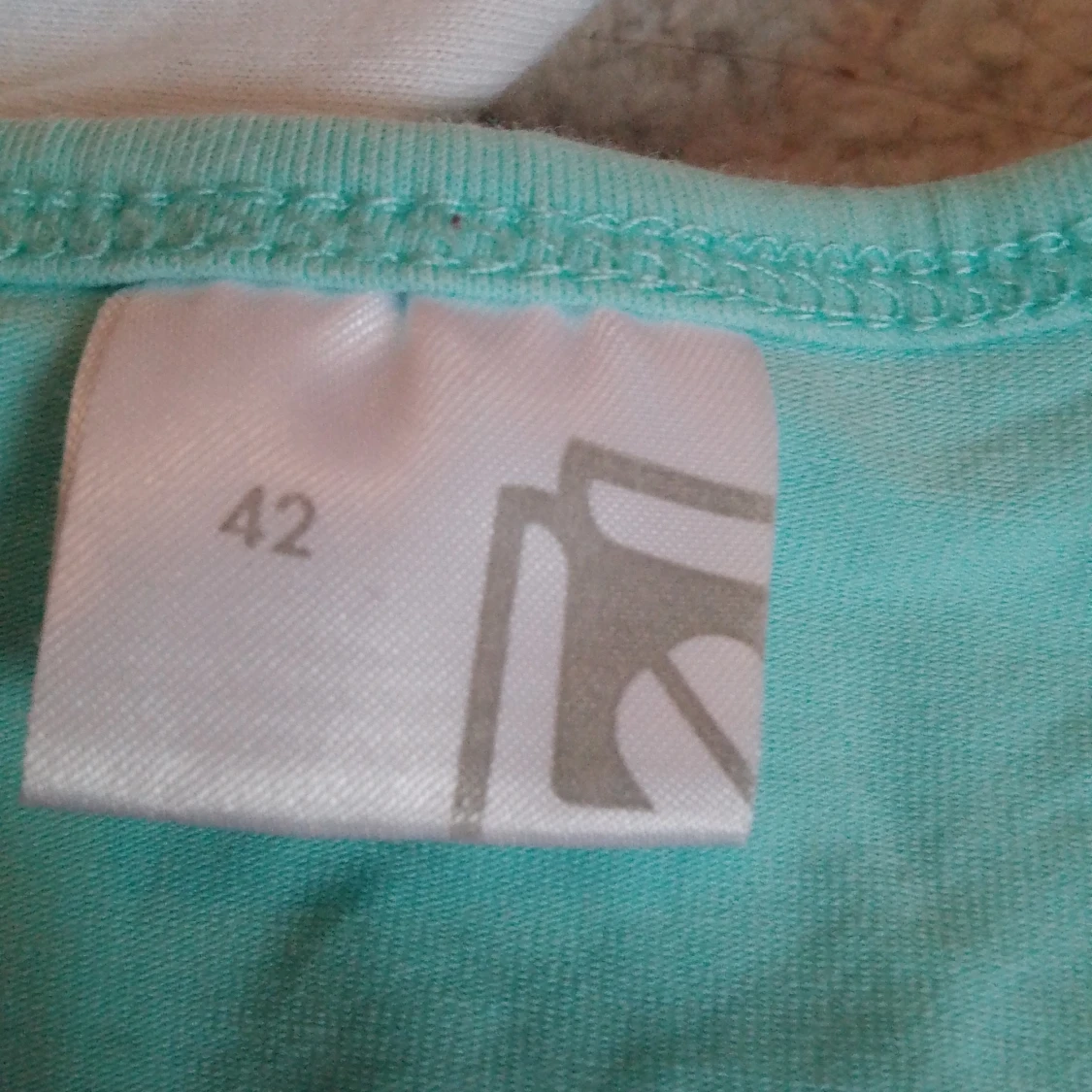 Turkos ärmlös linnetopp - 90