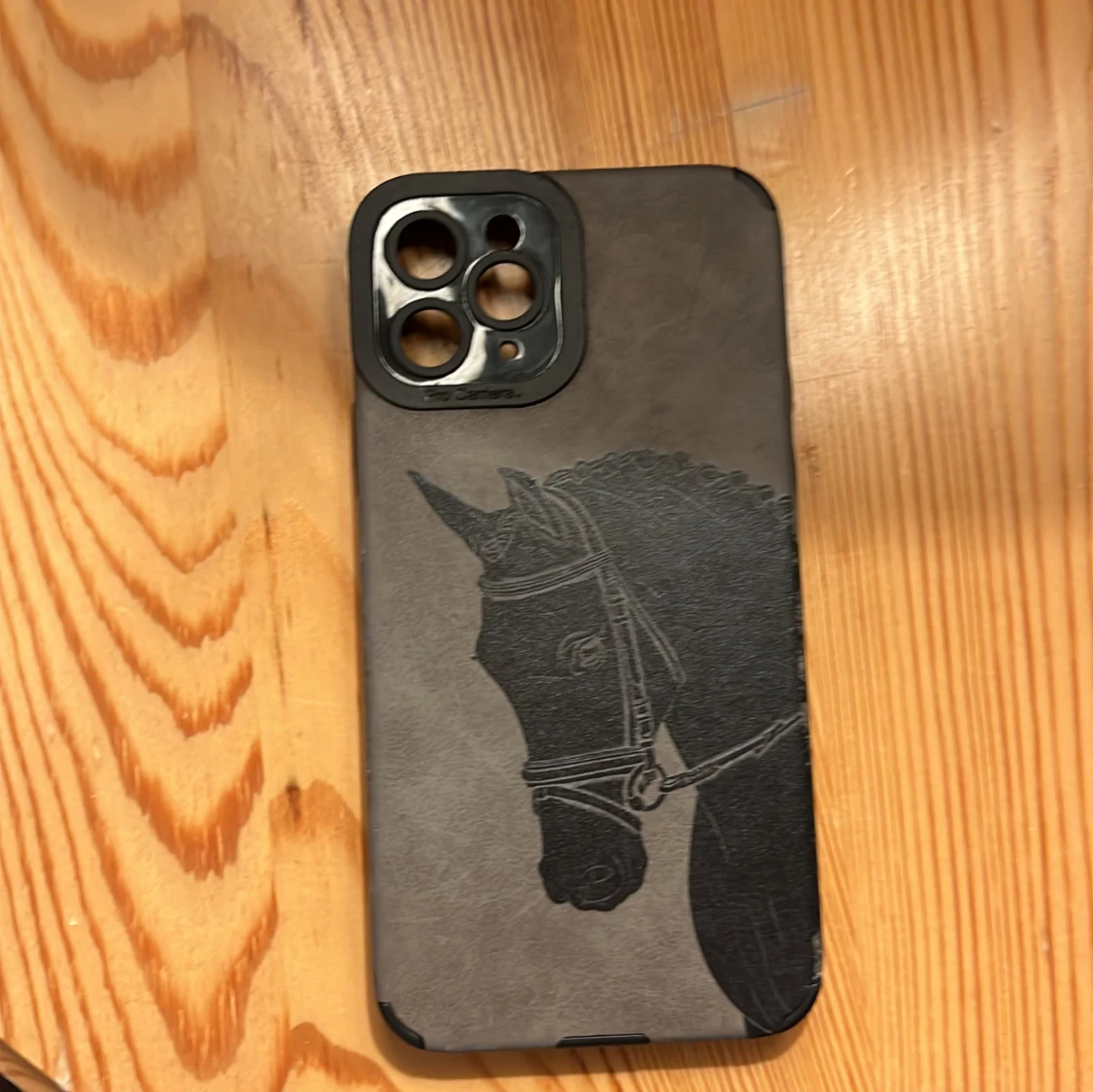 Mobilskal med häst på