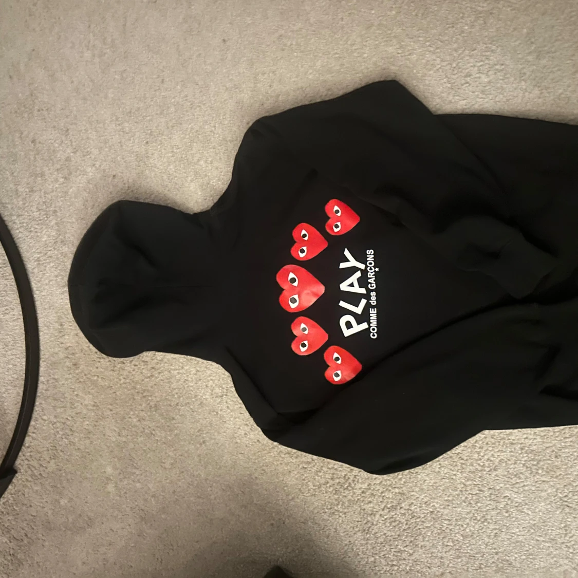 Svart hoodie från Comme des Garçons