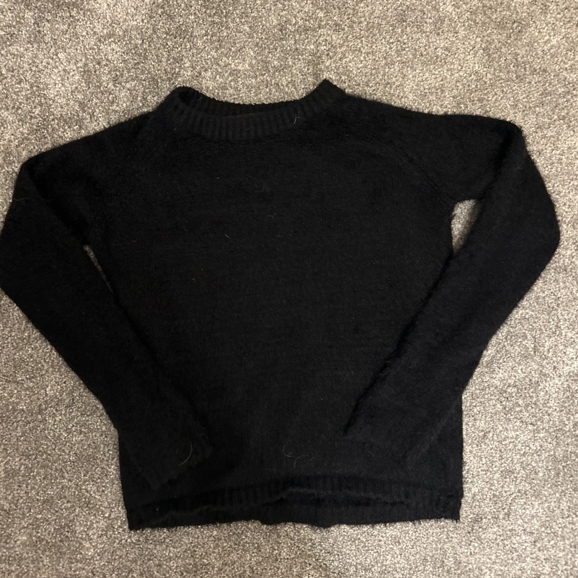 Svart stickad tröja