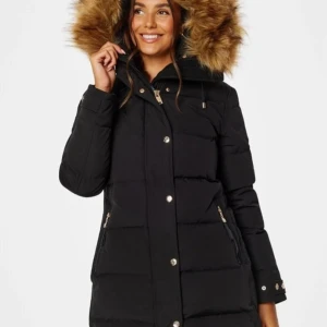 Vinterjacka Hollies storlek M svart /beige frg - Hollies Subway storlek 38/M  Färg svart/beige  Varm dunjacka från hollies  Fodrade fickor med dragkedja Vadderad luva Tvåvägsdragkedja framtill med tryckknappar Avtagbar fuskpälskant på luvan  Fodrad . 