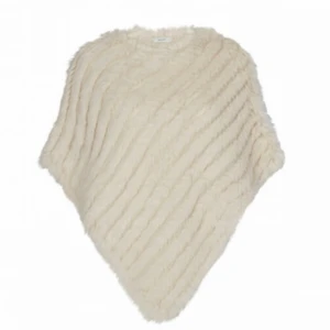 Pälsponcho - Pälsponcho i beige. 