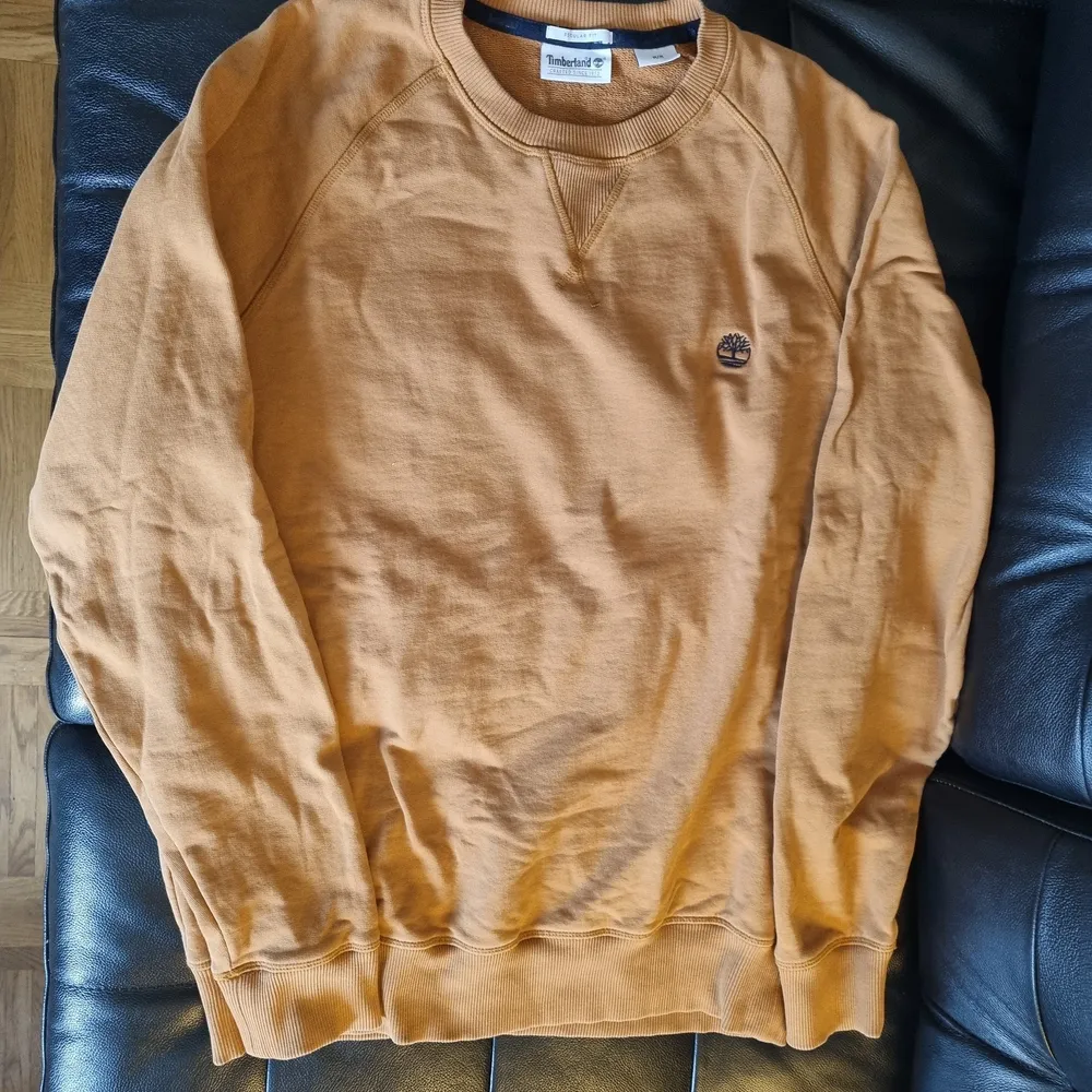Timberland sweater Size M , burnt orange color, worn a few times(4) . Hoodies.