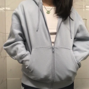 cheshire cat alice in wonderland hoodie - super warm Baby blue zip up hoodie with the cheshire cat on the back(alice in wonderland)!! needs a good home for someone who will really enjoy it... only worn once (too small for me) 💙 