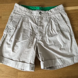 vintage beige acne shorts - super nice vintage Acne shorts with green inseams! selling them because they dont fit 💔 in great condition! tag says its a size XS but fits up to an M! 