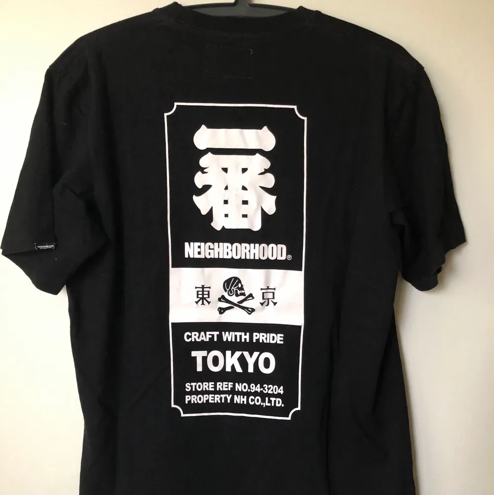 Neighborhood / NBHD Back Logo T-Shirt  Size tag large, but fits like a men’s small tee.  Great condition, no flaws or damage.  DM if you need exact size measurements.   Buyer pays for all shipping costs. All items sent with tracking number.   No swaps, no trades, no offers. . T-shirts.
