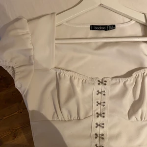 Topp - Blus/topp med korsettdetaljer