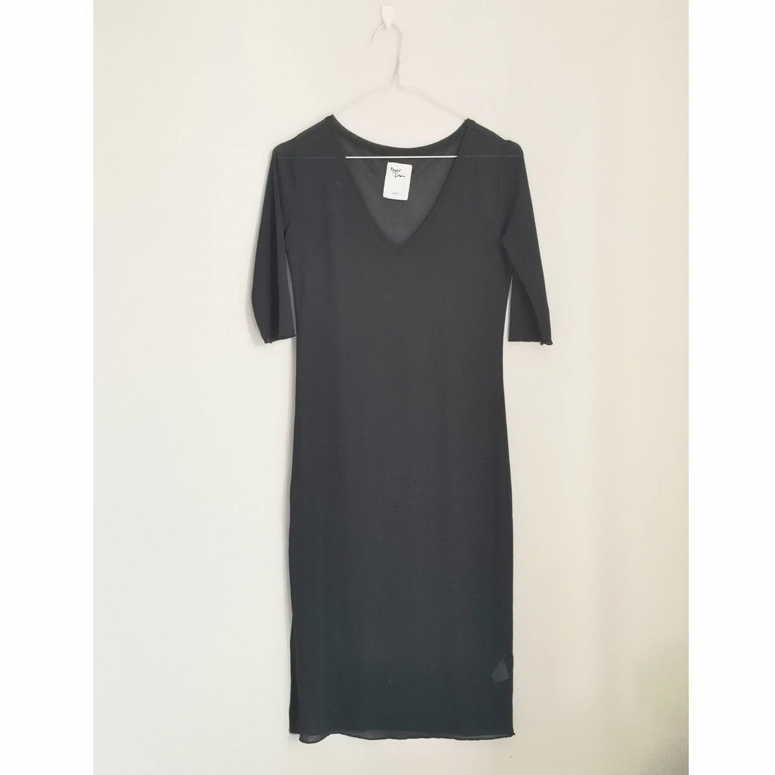 Transperant svart klänning