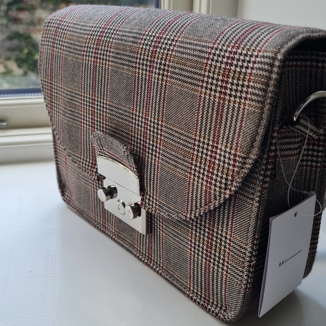 Brand new checked bag - 90