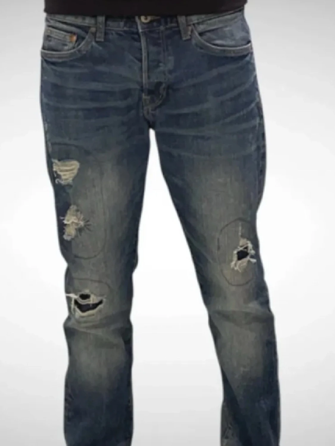 Blå slitna jeans med hål - 1