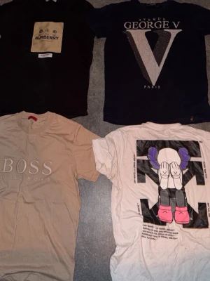 Feta tshirts läs beskrivningen  - Säljer fyra snygga t-shirts alla går för 500 per styck förutom boss tshirten som går för 250kr tar du alla tillsammans får du dom för 1,5 alla i storlek george V t shirten går för 1,3 ny pris 