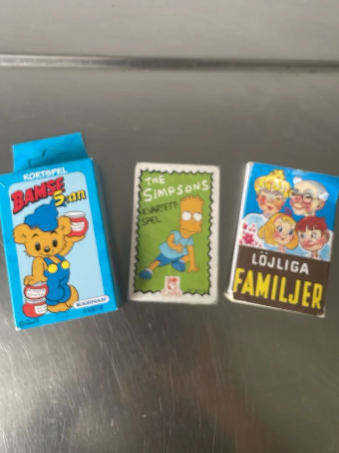 Tre kortspel: Bamse, Simpsons, Familjer
