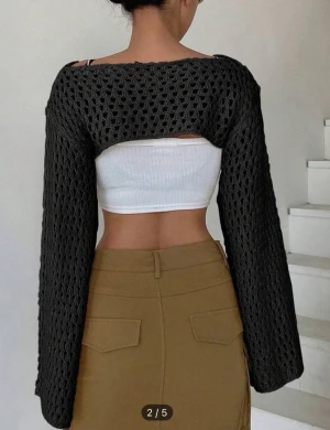 Black knitted bolero with cutout design/ svart stickad bolero - Never used because of wrong color. Bolero is in size M