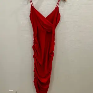 Beautiful “true red” bodycon  dress  in slinky fabric, simply dress it up with heels and some statement jewelry. Brand new, not worn.  BRAND: AX Paris 
