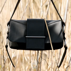 Black handbag  - Details - Silver details, Inner pocket, Closes with a hidden magnet.  Really taken care of no damage on the bag.   Original price: 2999 kr My price: 2000 kr , with fast buy we can discuss the price 