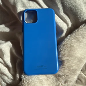 Holdit skal sky blue  - Ett holdit skal som är lite sönder vid laddnings hålet sky blue 