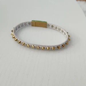 Edblad armband - Oanvänd vit och guld armband.
