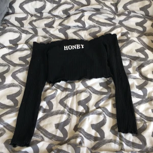 Topp - En svart topp i storlek xs