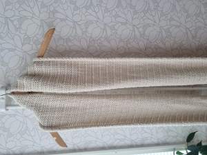 Nice and warm scarf used for one season. The colour is off white.