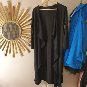 Tunn trenchcoat  - Aldrig använts 