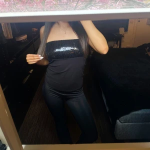 Svart glittrig tubtop - Så snygg glittrig tubtopp