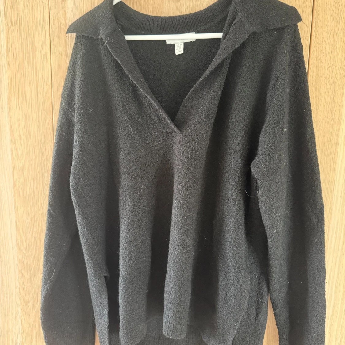 Svart stickad tröja med krage H&M XS