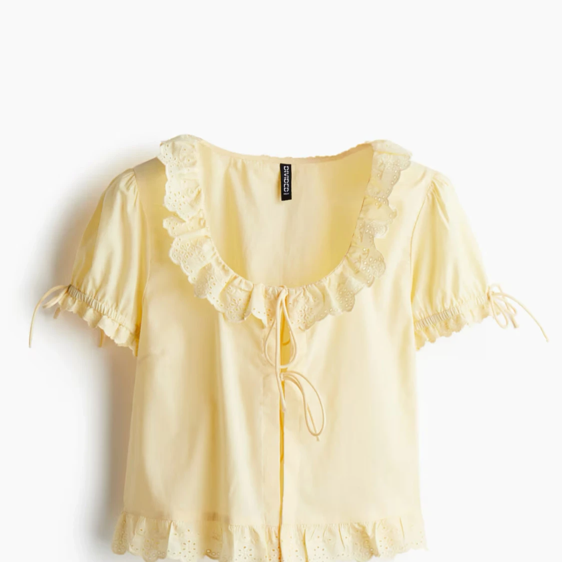 Gul blus med volang och knyt från Divided