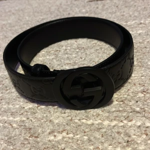 Svart GG bälte - Pris kan diskuteras