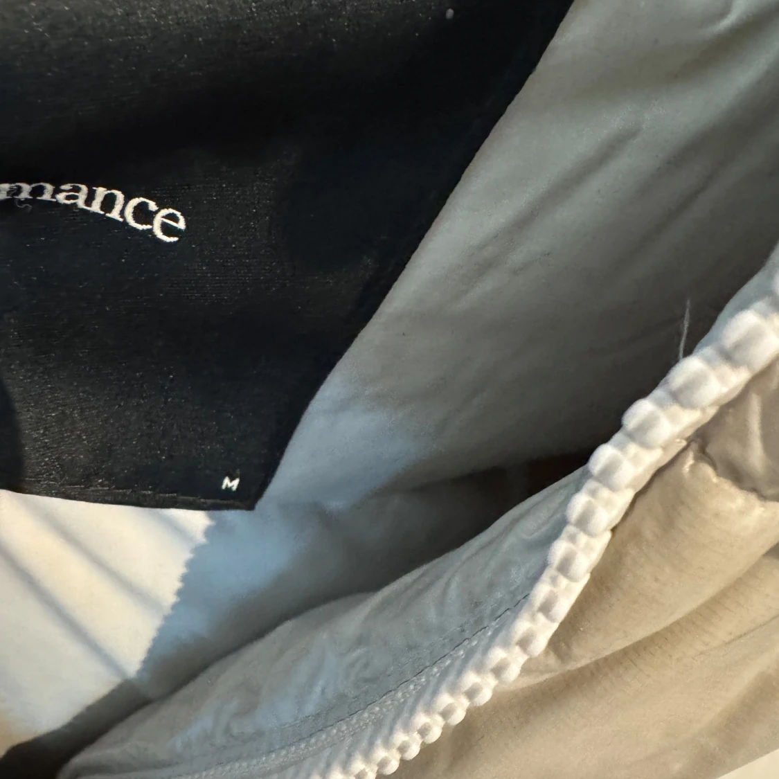 Beige dunjacka från Peak Performance - 1