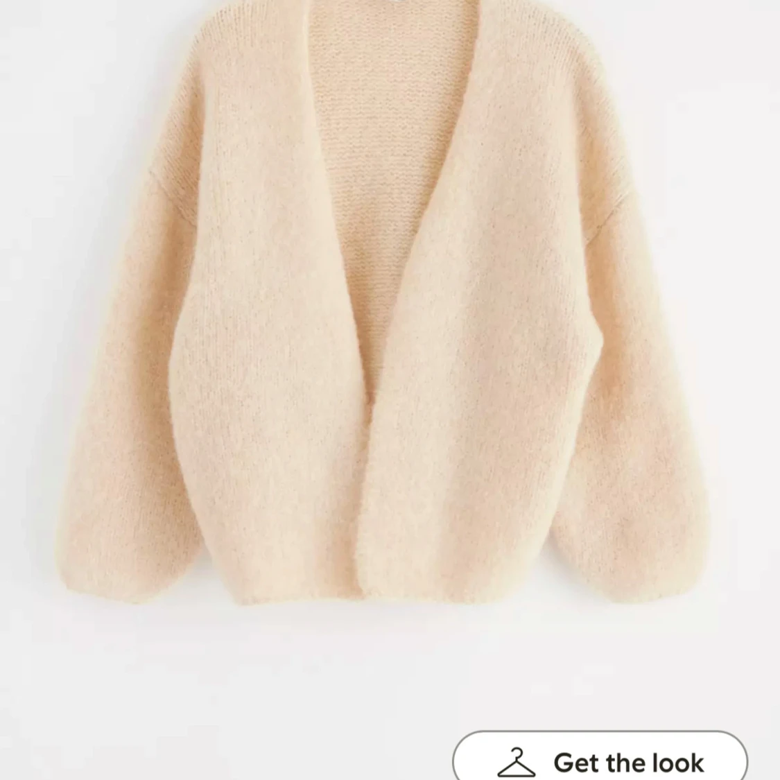 Beige stickad kofta från Lindex