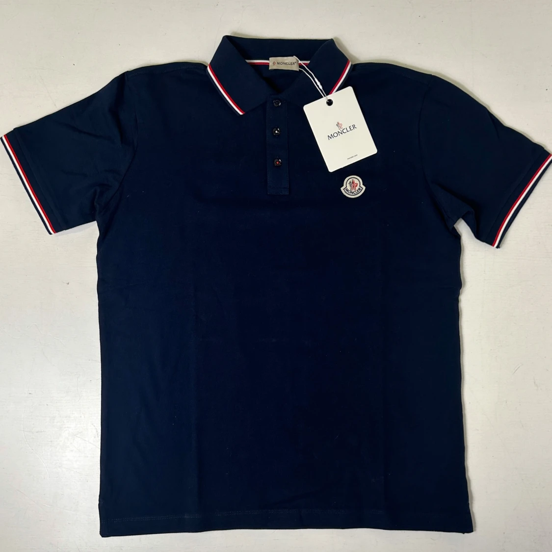 Mörk blå pikétröja från Moncler