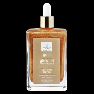 Gold Shimmering Glow Oil från Miqura - Lyxig kroppsolja med guldskimmer från Miqura. Oljan ger huden en glittrande finish och extra lyster. Kommer i en fyrkantig glasflaska med pipett och gulddetaljer. Passar normal till torr hud.
