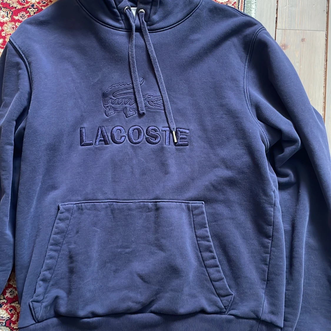Mörkblå hoodie från Lacoste - 1