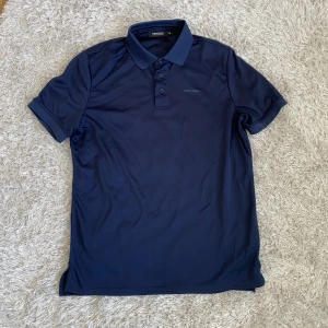 Tenson golfpiké  - Golfpiké i mycket fint skick. Marinblå, strl M