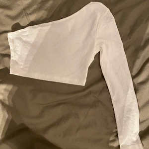 Topp - Oanvänd topp i storlek Xs. 