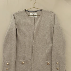 Cardigan  - Nyskick i stl Xs/s