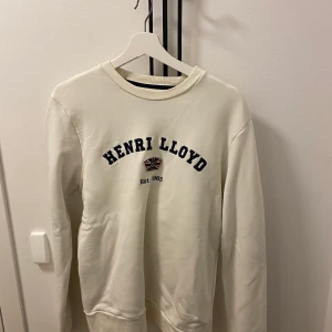 Henri lloyd - En vit snygg Henri lloyd tröja i storlek medium