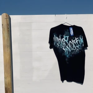 Hand-painted calligraffiti T shirt - The shirt itself is brand new, the paint is fabric paint which is washable at 40 degrees! The size of the shirt is large, but it’s more like an oversized M